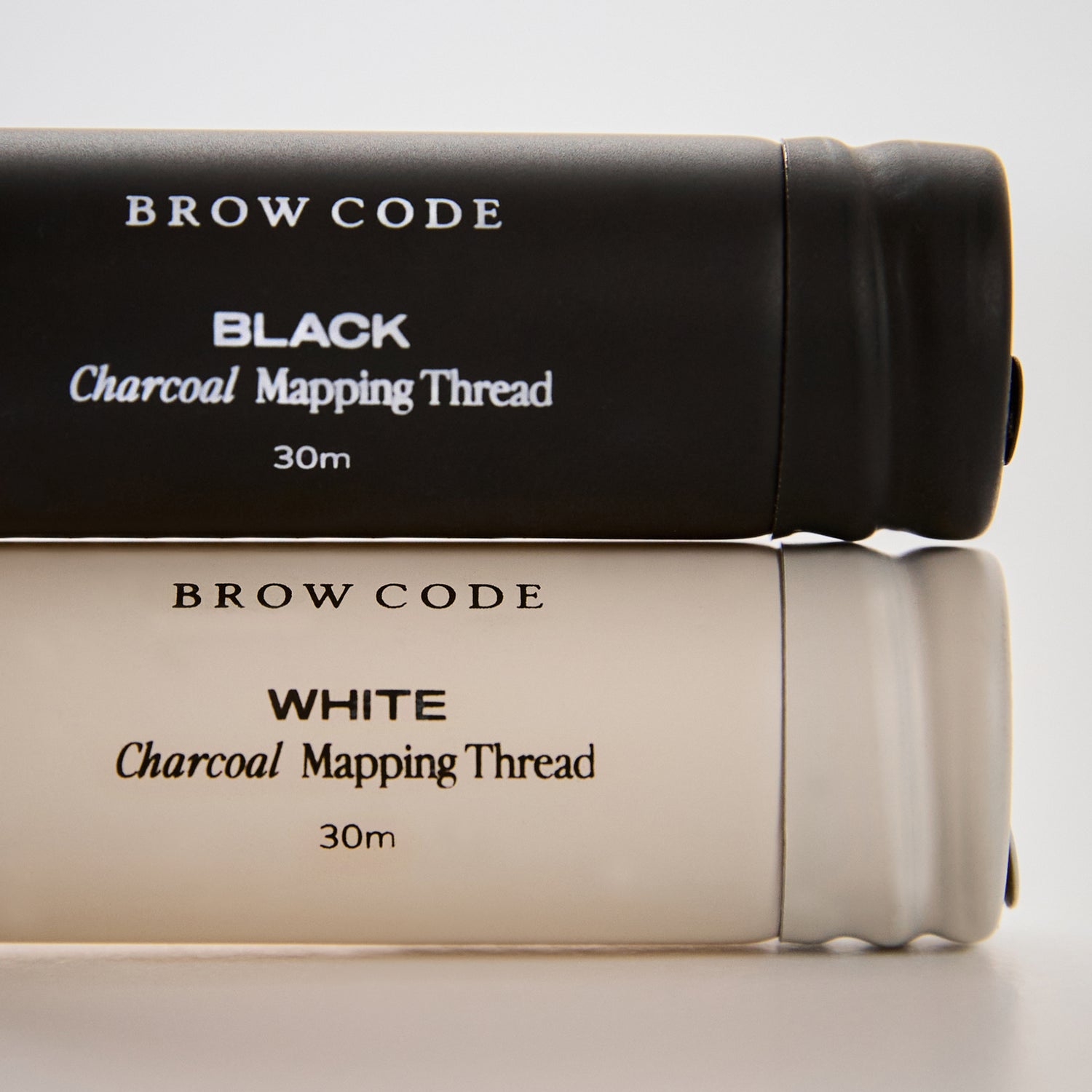 Charcoal_Brow_Mapping_Thread_Packaging lying on it's side against a gray background