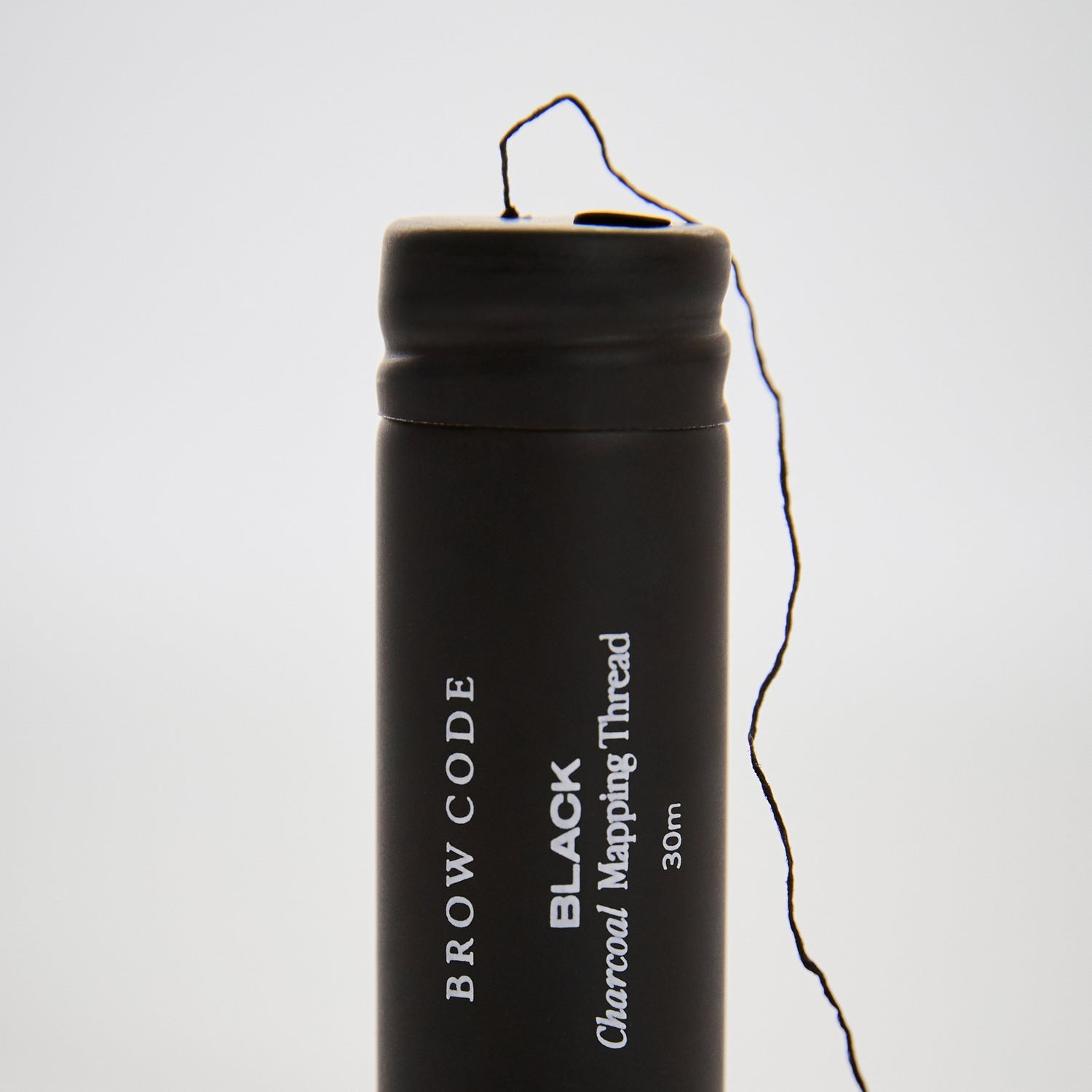 Charcoal_Brow_Mapping_Thread_Packaging standing up with thread coming out-color-black
